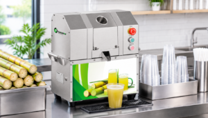 Compact commercial sugarcane juicer positioned on a planned small-shop counter workstation
