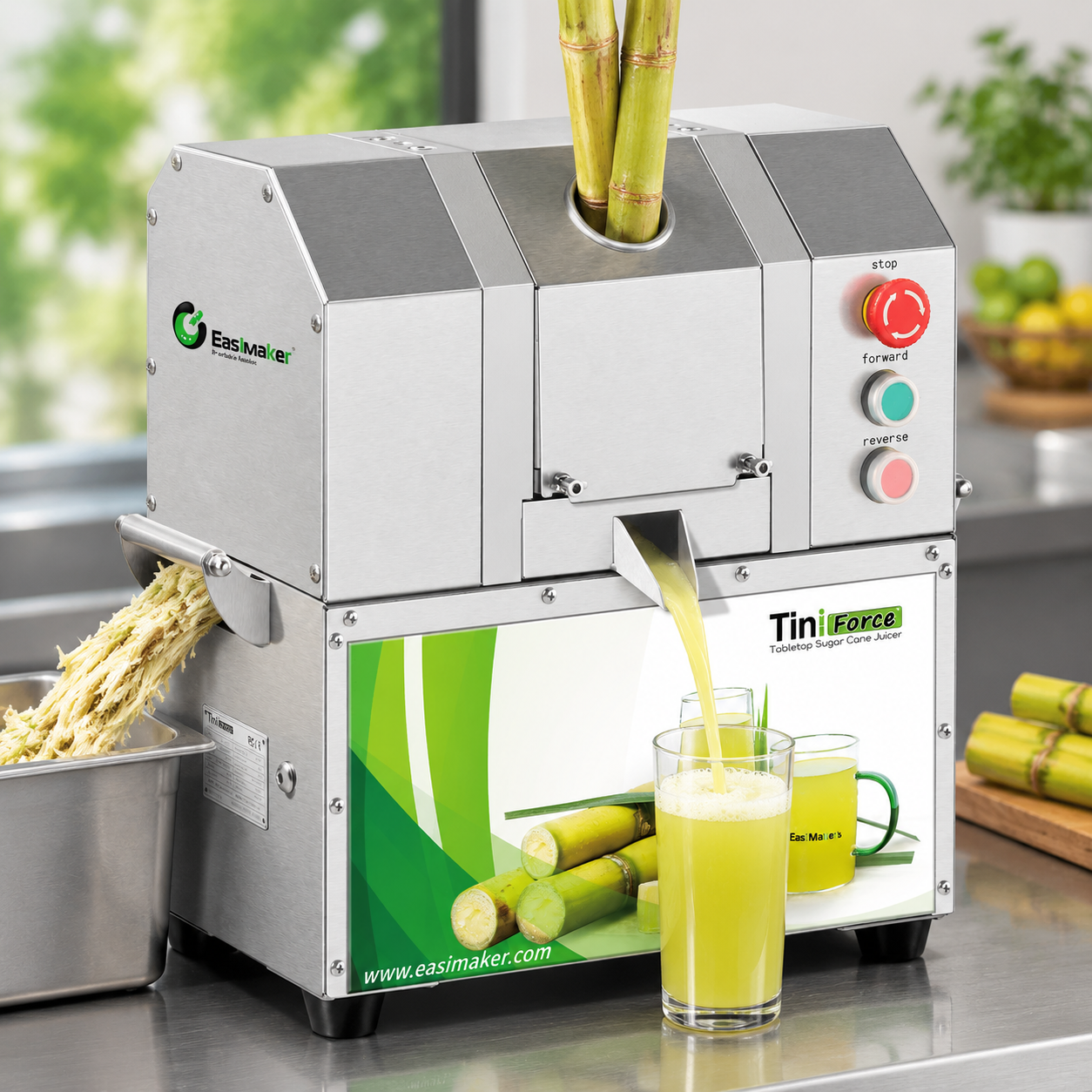 Prepared sugarcane aligned with the front feed inlet of a commercial juicer