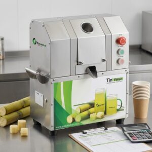 Commercial sugarcane juicer beside a break-even planning worksheet