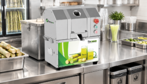 Commercial sugarcane juicer with covered bagasse collection bin for waste management