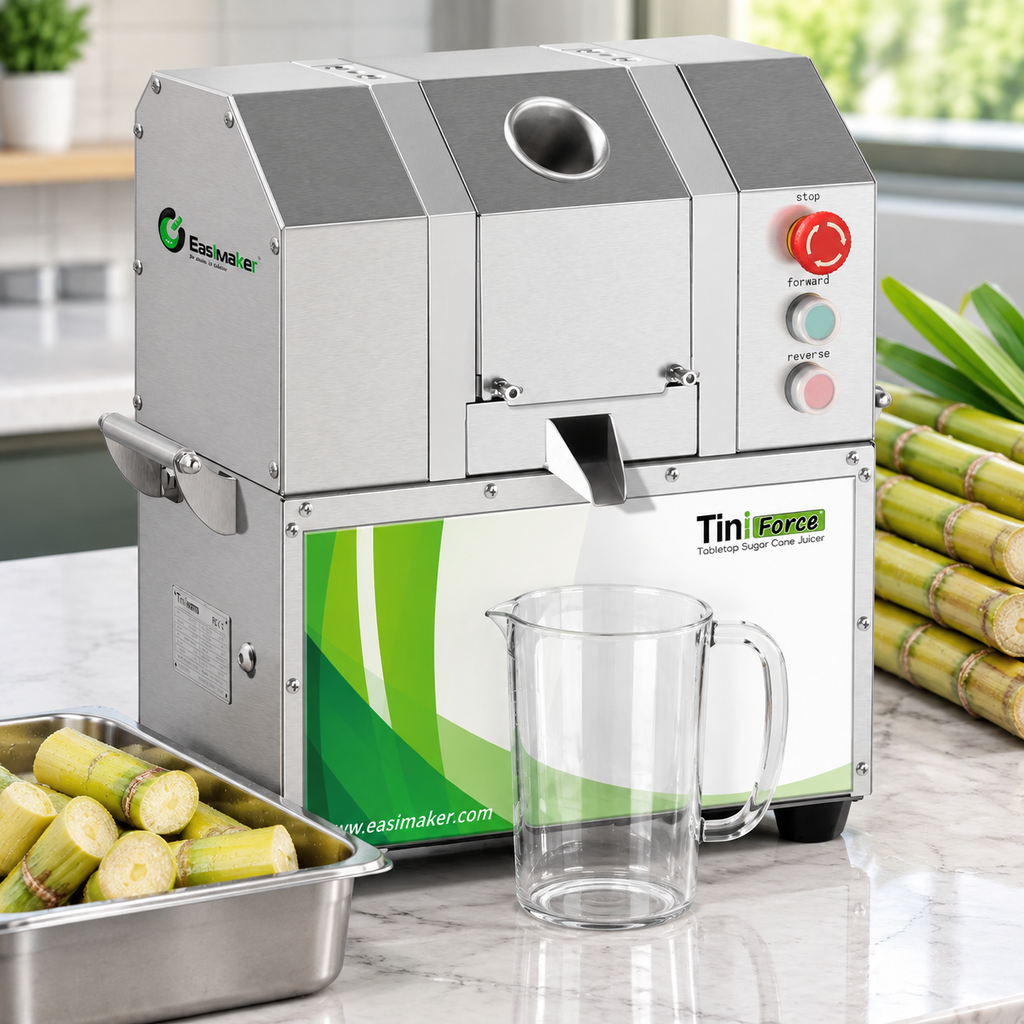 Commercial sugarcane juicer set up with prepared cane and juice collection container